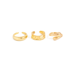 Set of three golden adjustable rings featuring smooth, hammered and twisted textures