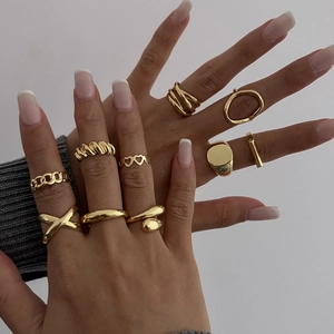 10-piece gold geometric ring set with heart and textured designs for stacked wearing