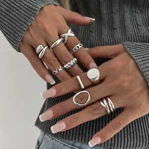 10-piece minimalist silver geometric ring set with chain, cross, and heart designs