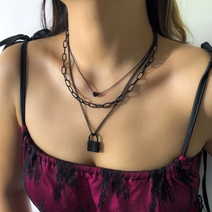 Three-layer punk necklace featuring a black heart charm and rectangular lock pendant