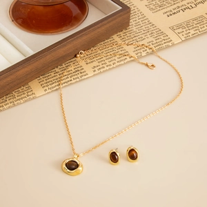 Parure collier et boucles d'oreilles dorés rétro avec pendentifs ovales en œil de tigre