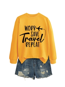 Detailed flat lay of a yellow sweatshirt with black text and distressed denim shorts