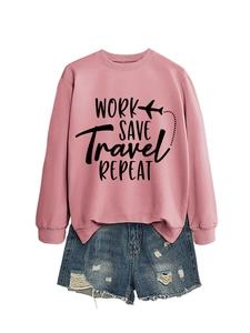 Flat lay of pink sweatshirt with travel print and distressed denim shorts set