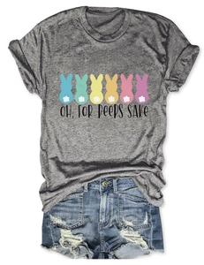 Flat lay of gray t-shirt with colorful rabbits print and distressed denim shorts