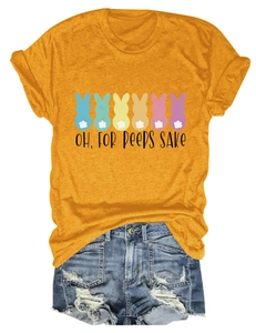 Flat lay of yellow Easter bunny t-shirt with denim shorts showing fabric and graphic details