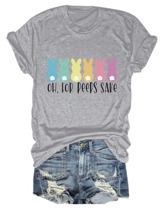 Flat lay of gray T-shirt with Easter bunny print paired with ripped denim shorts