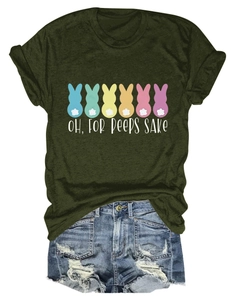 Flat lay detail of olive green T-shirt with bunny print and distressed denim shorts