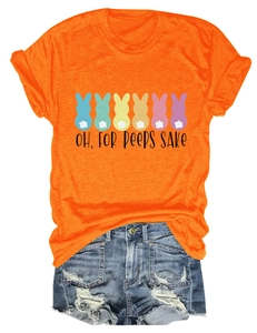 Detail of orange t-shirt with colorful bunny prints and distressed denim shorts set