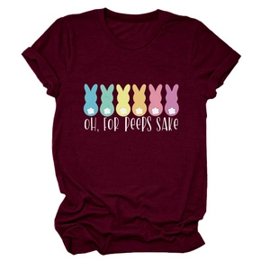 Flat lay of burgundy Easter t-shirt with colorful bunny silhouettes and white peep text