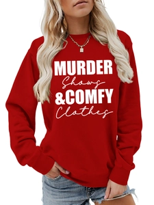 Detail of red crewneck sweatshirt featuring white Murder Shows & Comfy Clothes slogan print