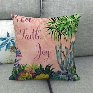 Detailed texture of linen pillowcase with tropical palm plants and Peace Faith Joy text