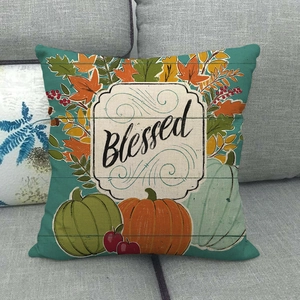 Detail of linen pillow cover with pumpkins, maple leaves, and Blessed text embroidery