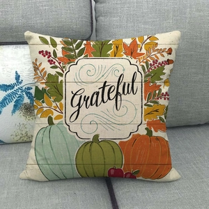 Detail of linen pillowcase with Grateful text and colorful pumpkin autumn harvest print