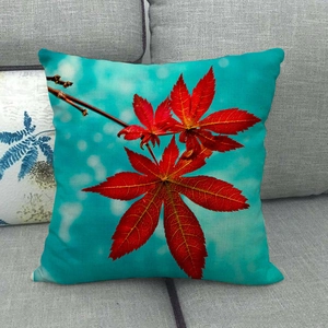 Detailed close-up of maple leaf print on linen throw pillow showing fabric texture