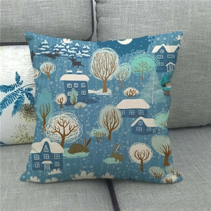 Close-up of linen pillowcase featuring blue winter village scene with deer and rabbits