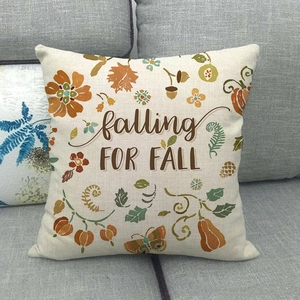 Detail showing 'falling FOR FALL' linen pillowcase with pumpkin and maple leaf patterns