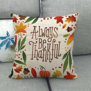 Detailed close-up of Always Be Thankful linen pillow cover with fall leaf and pumpkin patterns
