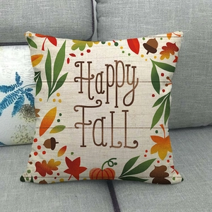 Happy Fall linen pillow cover featuring festive pumpkins and autumn maple leaves on sofa