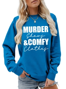 Close-up of blue crewneck sweatshirt featuring white Murder Shows & Comfy Clothes print