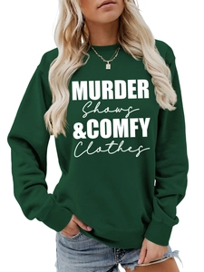 Detail of dark green hoodie featuring white Murder Shows & Comfy Clothes graphic print