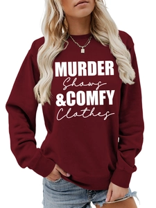 Detail of burgundy crewneck sweatshirt with white Murder Shows & Comfy Clothes slogan