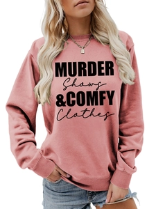 Close-up of black typography print on dusty rose crewneck sweatshirt cotton fabric