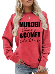 Close-up of brick red sweatshirt with Murder Shows and Comfy Clothes printed text