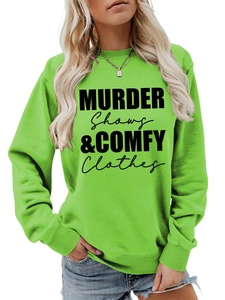 Detail of green crewneck sweatshirt with black Murder Shows & Comfy Clothes typography
