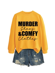 Detail of yellow sweatshirt with black Murder Shows & Comfy Clothes text print