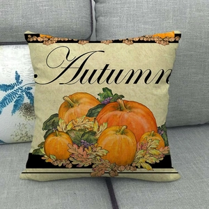 Housse de coussin d'automne en lin avec motif citrouille sur un canapé gris