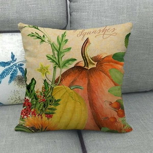 Détail d'une housse de coussin en lin avec motif de récolte de citrouilles et tournesols