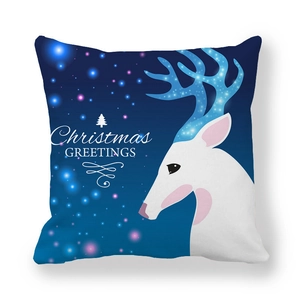 Detail of Christmas pillowcase with white reindeer and Christmas GREETINGS print