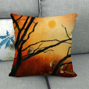 Detailed view of owl print on linen pillowcase texture resting on a soft grey sofa