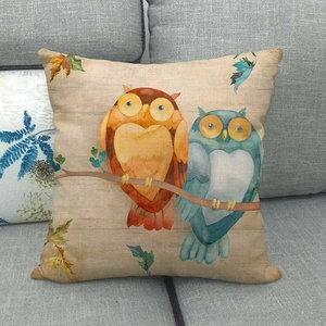 Cute watercolor owl pattern square linen pillow cover on a grey sofa for home decor
