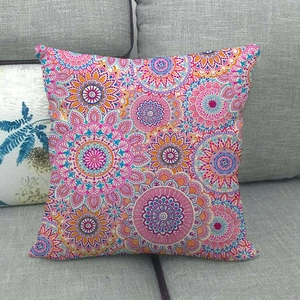 Detail of colorful bohemian mandala geometric pattern on linen throw pillow cover on sofa