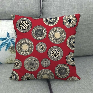 Bohemian mandala geometric pattern red linen pillow cover on grey fabric sofa