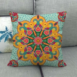 Close-up of bohemian linen pillowcase with vibrant symmetrical mandala floral pattern