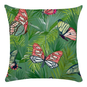 Macro detail of tropical butterfly print on green palm leaves pillow case fabric