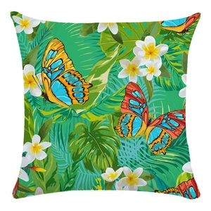 Close-up of tropical leaf pillowcase with vibrant butterflies and frangipani flowers