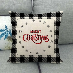 Detail of Christmas pillow cover with Buffalo Plaid edges and merry christmas text