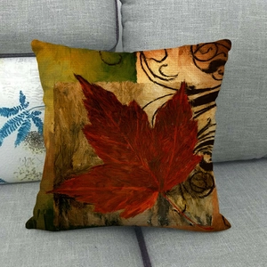 Detail of oil painting style red maple leaf print on rustic linen decorative pillowcase