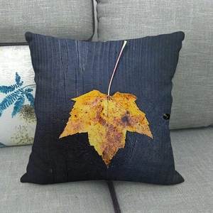 Fall maple leaf decorative linen pillowcase with black wood grain background on sofa