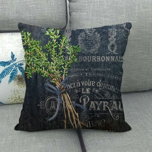 Detail of vintage linen pillowcase featuring botanical herbs and French typography