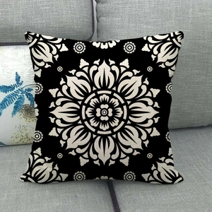 Bohemian geometric mandala pattern linen pillowcase on a modern grey fabric sofa
