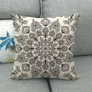 Macro detail of bohemian mandala geometric pattern on a cream linen pillowcase