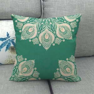 Close-up of bohemian green mandala pattern linen pillowcase on a grey sofa fabric