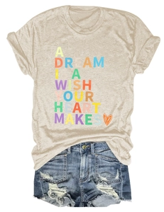Flat lay of apricot t-shirt with artistic text and distressed blue denim shorts set