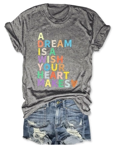 Flat lay of gray cotton T-shirt with heart quote and distressed denim shorts set
