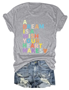 Flat lay of gray crew neck T-shirt with quote print and ripped denim shorts