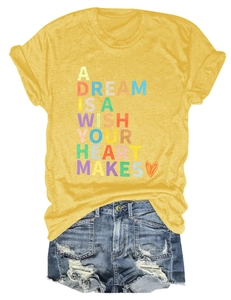 Detail of a yellow cotton T-shirt featuring colorful slogan print with blue denim shorts